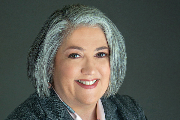 studio portrait of Donnalyn Pompper on a gray backdrop