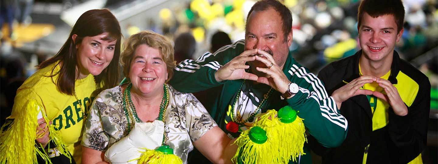 A family throwing the O at a football game