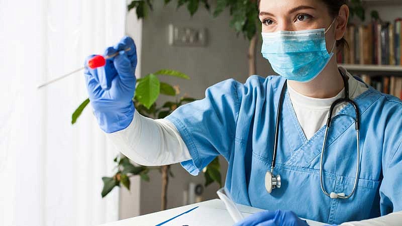 Doctor with testing swab