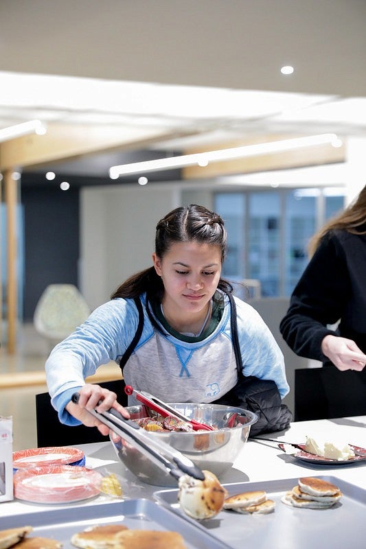 Student getting pancakes