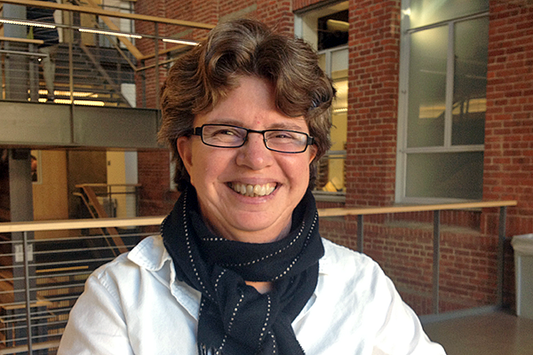 portrait of Gabriela Martinez with the Allen Hall stairs in the background