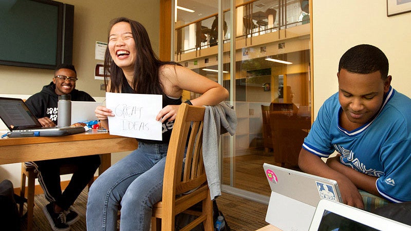 Students studying in a Global Scholar's Hall room