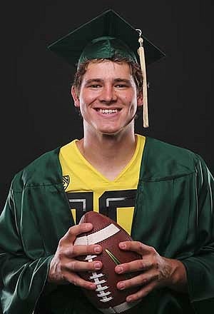 Justin Herbert in cap and gown