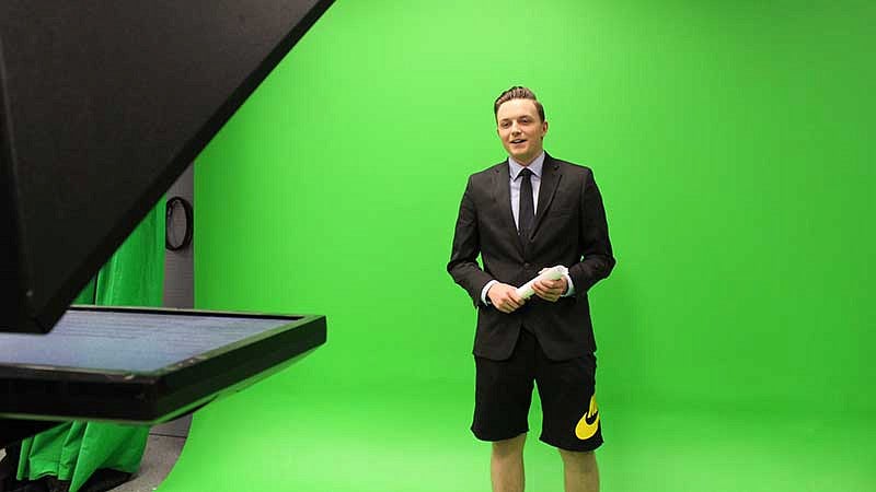 DuckTV reporter in front of a green screen