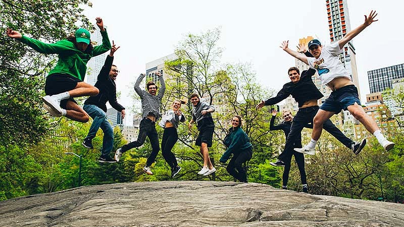 UO SOJC students James Vos, Ben Knauer, Thomas Rice, Gianni Nardi, Kyle Steffens, Emily Pearson, Kathryn Harris, Casey Hickman, Jordan Bremer jumping in Central Park