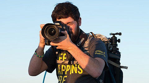 Justin Hartney shooting photos at the top of Spencer Butte