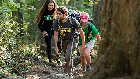 Justin Hartney hiking to the top of Spencer Butte to shoot photos