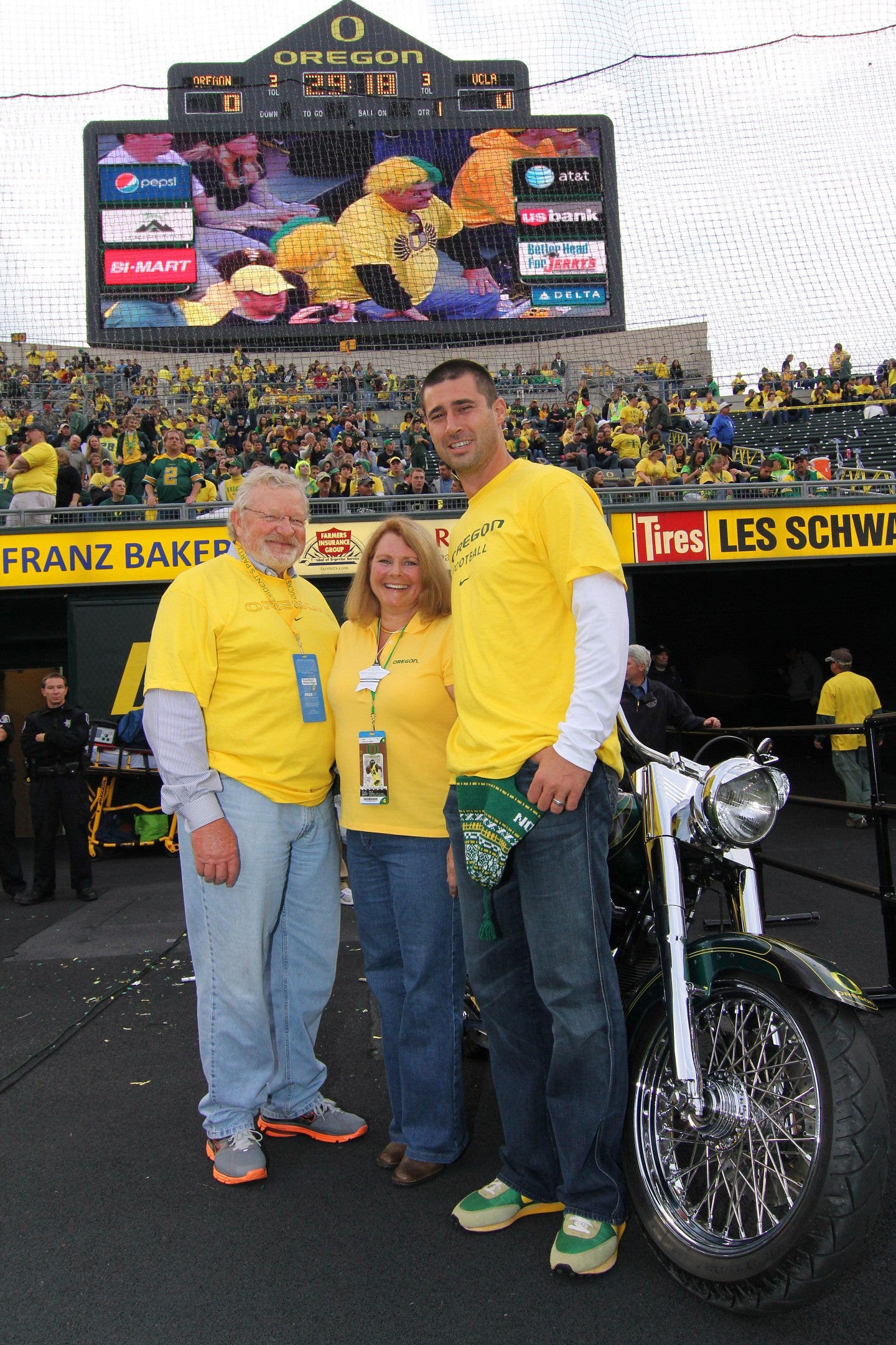 Gwen and Chuck Lillis on a motorcycle at Autzen Stadium 