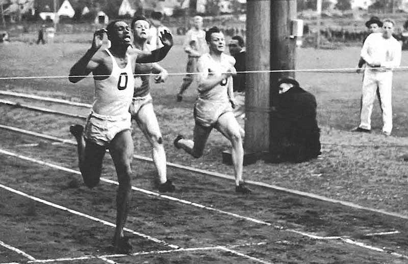 Mack Robinson crossing the finish line winning the 100 yard dash