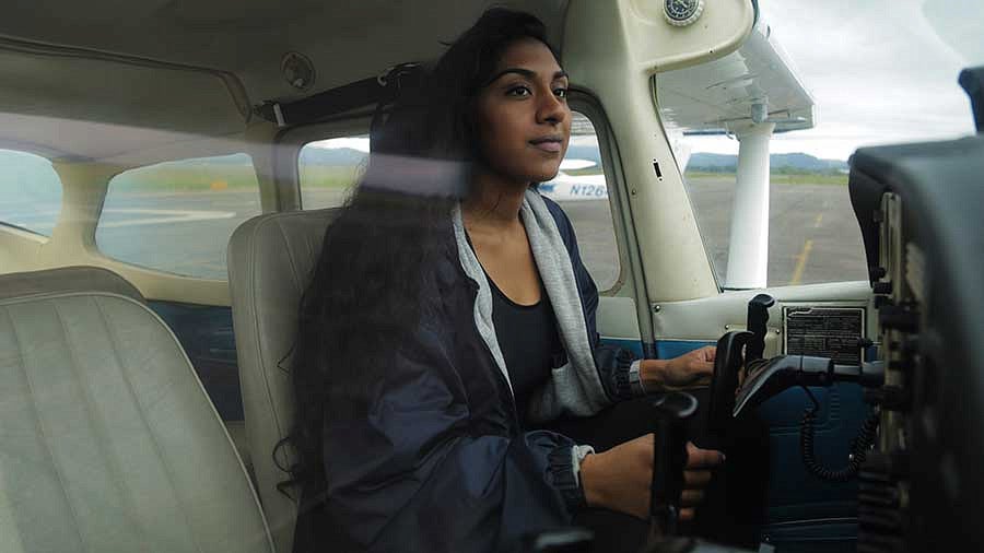 Manju Bangalore in the cockpit of an airplane