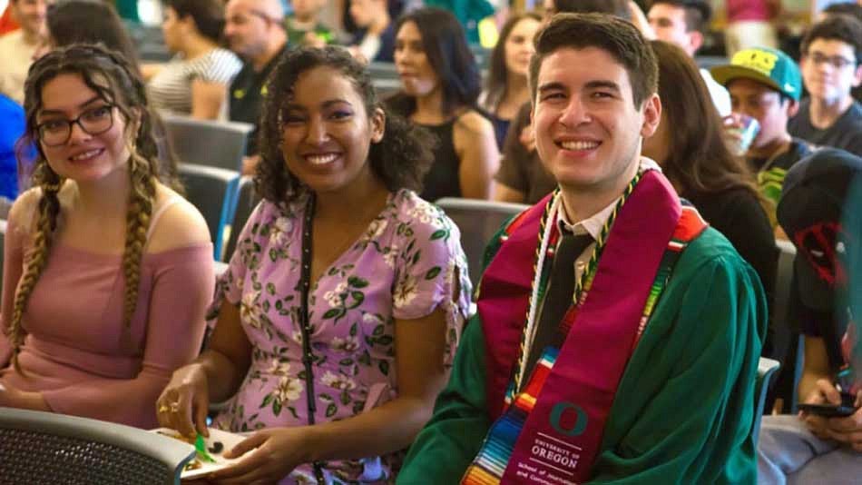 A student in cap and gown at commencement