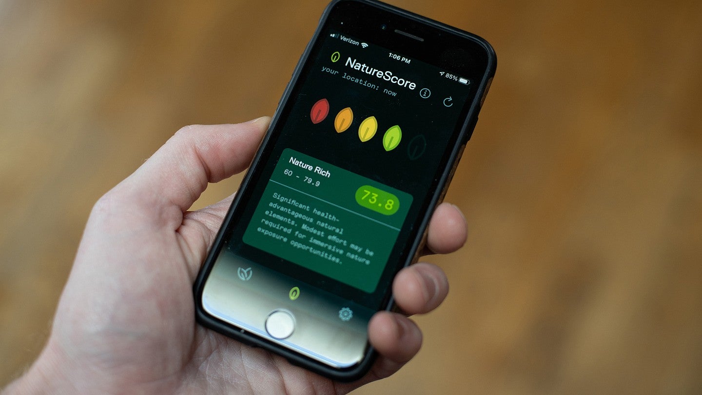The NatureDose app lets users track how much time they've spent in the outdoors. NatureDose app on smartphone