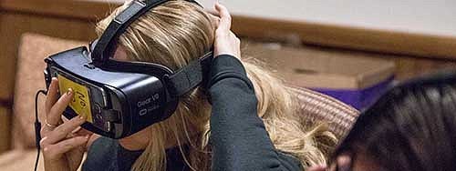 A woman wearing a VR headset