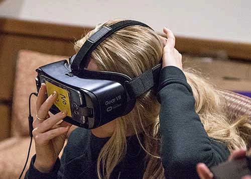 A woman wearing a VR headset