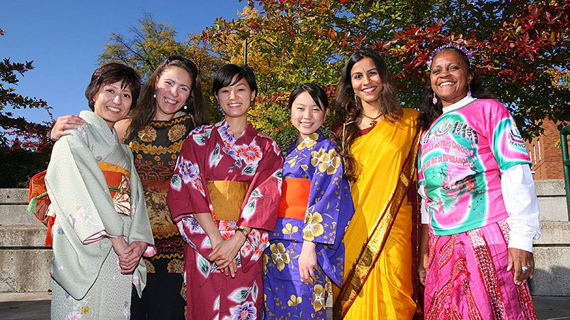 Students wearing culturally diverse formal wear