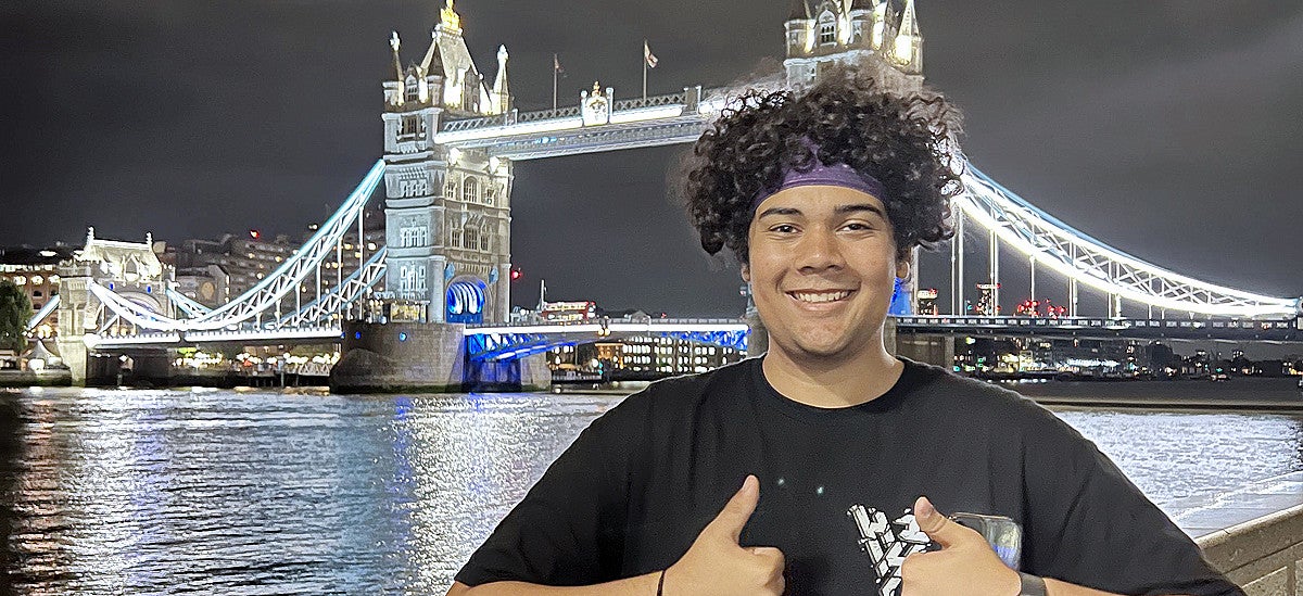 PathwayOregon scholar in front of London's Tower Bridge at night