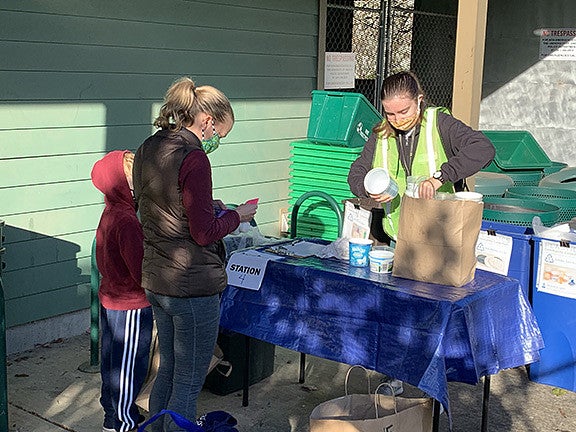 clients and worker at UO recycling center