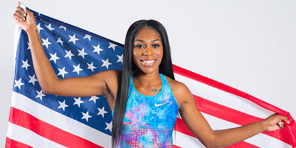 Raevyn Rogers holding an American flag