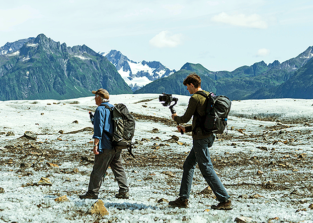 An SOJC student shoots footage on the Sheridan glacier in Alaska