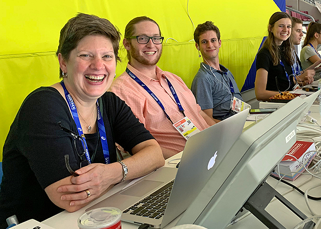 a professor and students at the World Track Finals