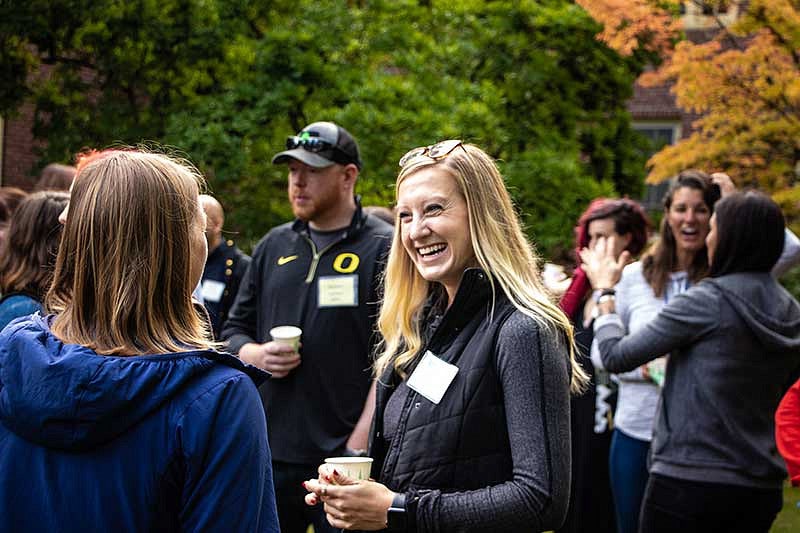 People chatting at an outdoors event