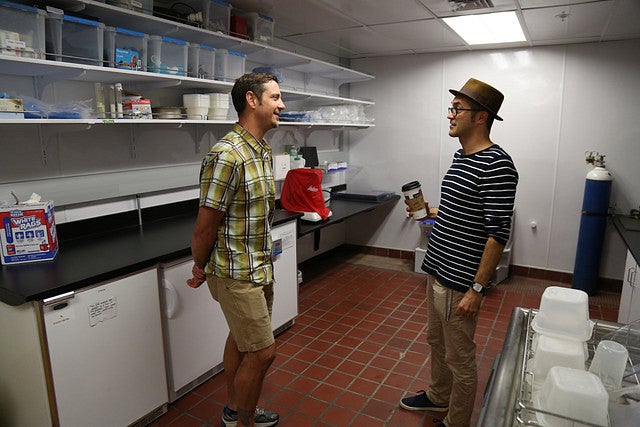 Steve Perry talking with Bill Cresko in the zebrafish lab