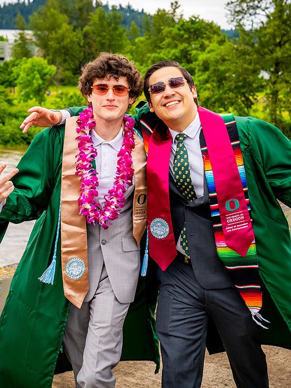 Students walking to Autzen stadium for the 2022 UO graduation