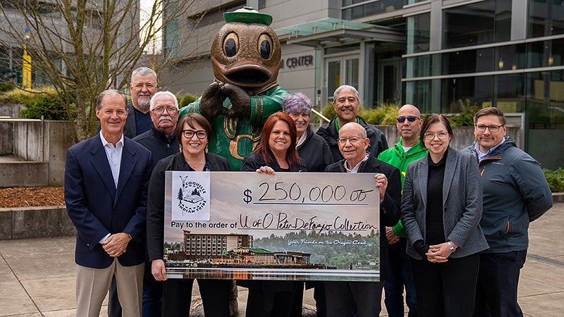 Tribal members, Peter DeFazio and others with check