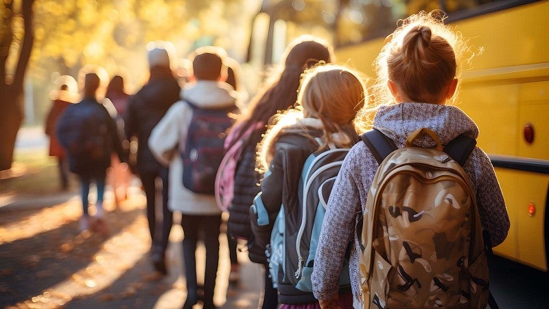 Kids in line for the school bus