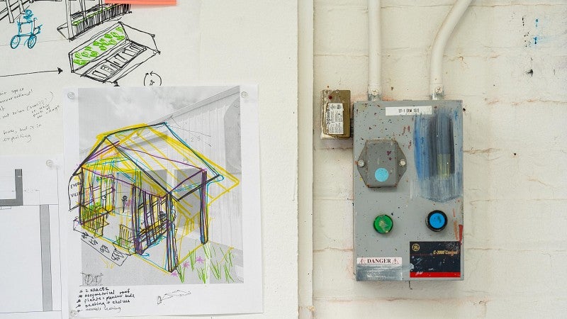 Illustration of a house design posted on the wall during the Bruton Design Intensive