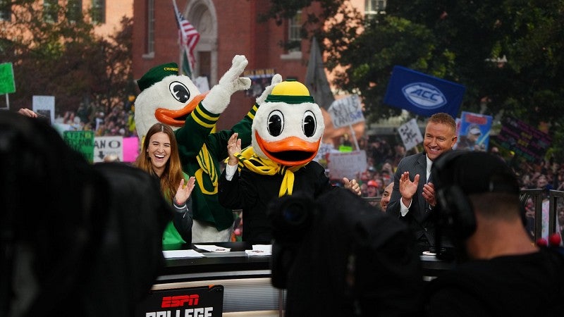 The College GameDay broadcasting team joined by Sabrina Ionescu and the Duck at a taping of the college football program