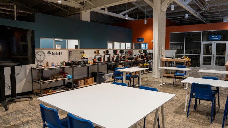 Work tables, 3-D printers and other equipment for youth to design and create at a nonprofit facility.