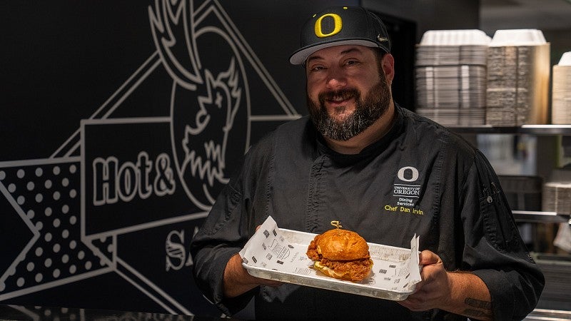 Chef Dan Irvin and one of his creations, a hot chicken sandwich