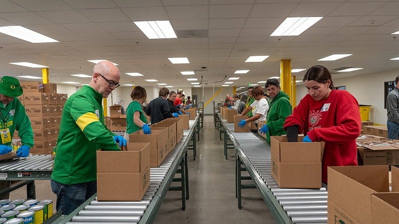 Volunteers packing food boxes at the LA Regional Food Bank.