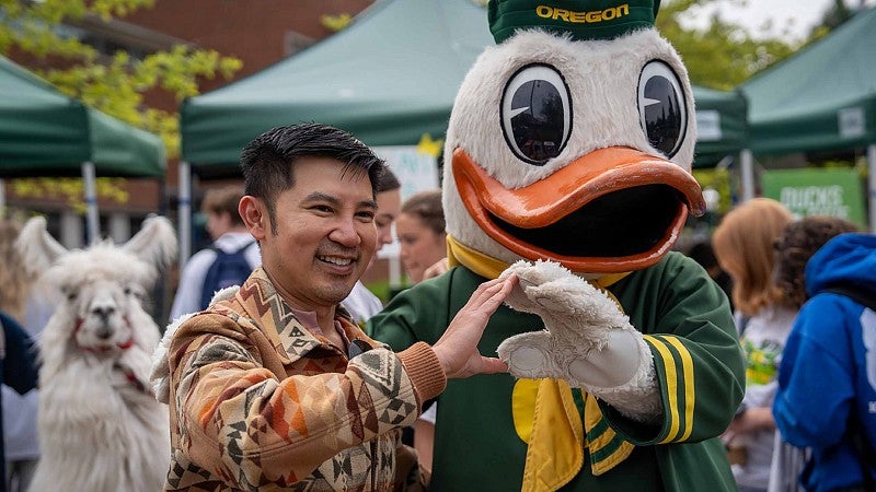 The Duck and a student throwing the O together