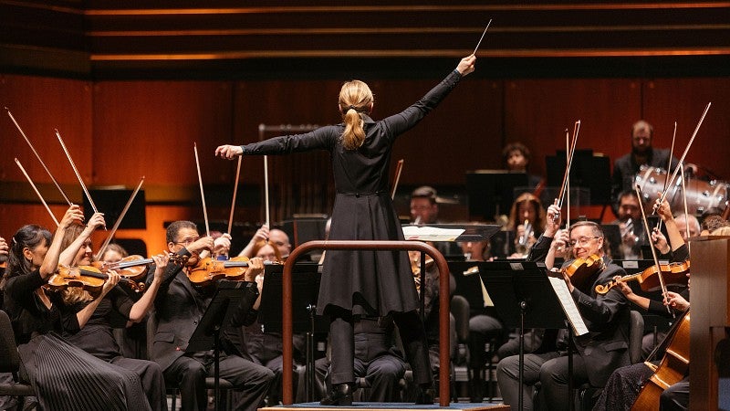 Conductor leading an organ symphony