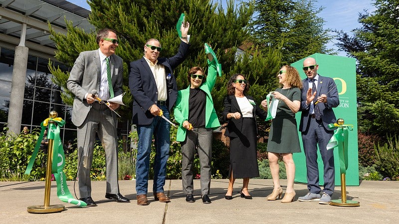 People celebrating a ribbon-cutting
