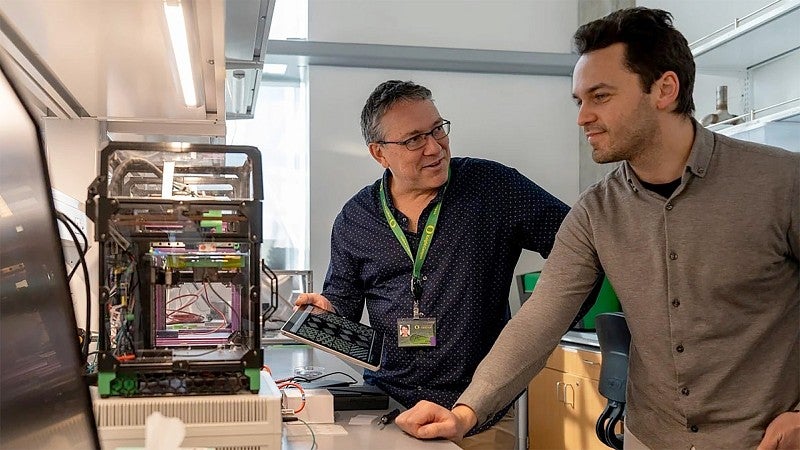 Paul Dalton, left, and Ievgenii Liashenko in their lab
