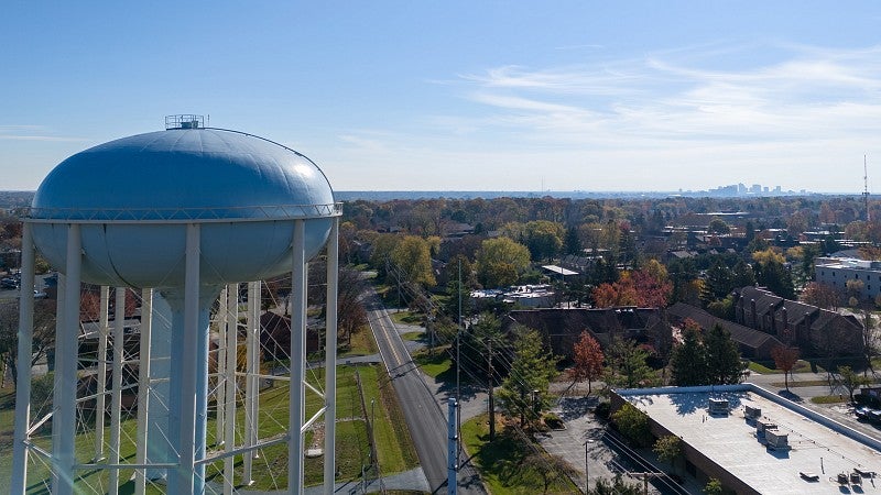 Water tower next to a small town