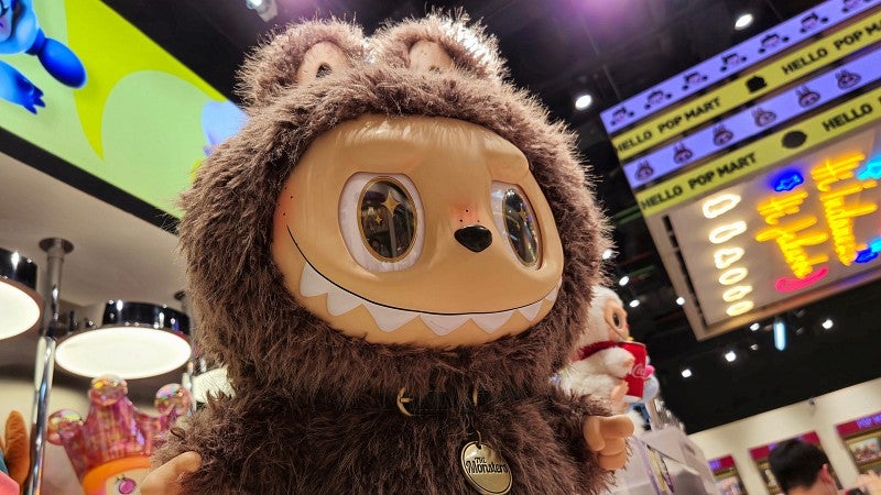 A Labubu plush toy in a store