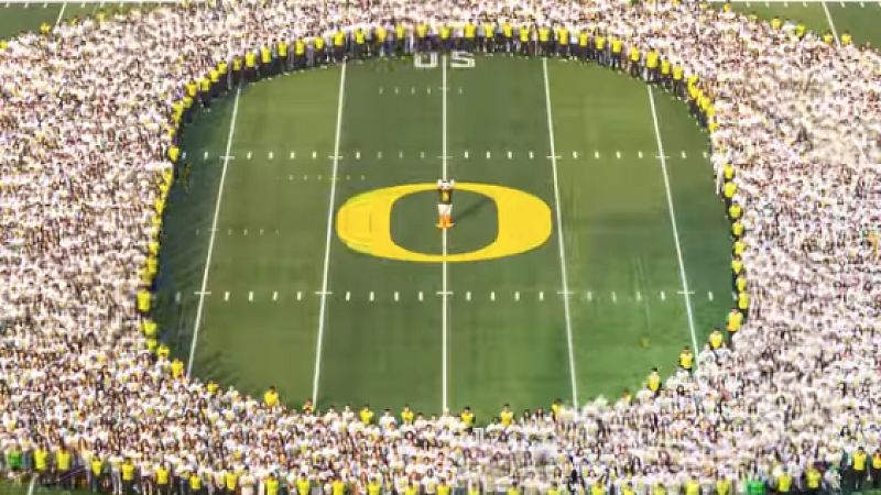 New students gathered in the shape of the O on football field 