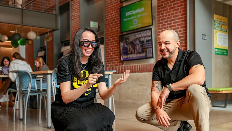 A student and professor test the smart glasses