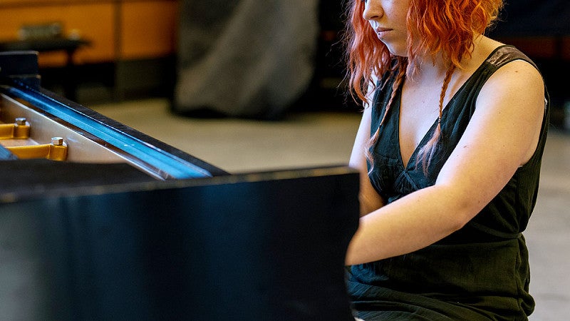 Student playing the piano