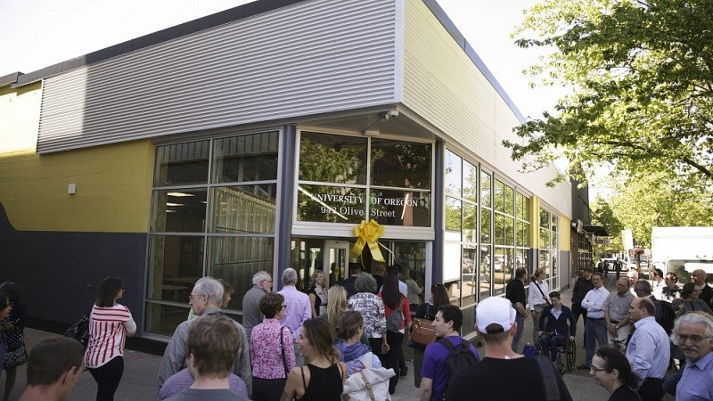 People entering 942 Olive after ribbon-cutting.