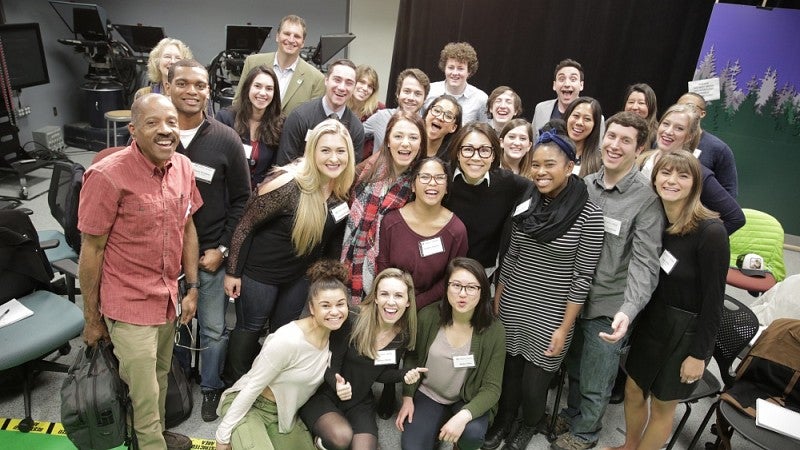 Ann Curry posing with students and faculty