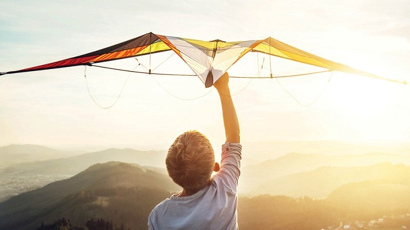Boy flying kite
