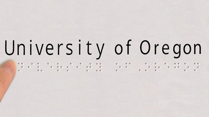 The words University of Oregon in text and Braille
