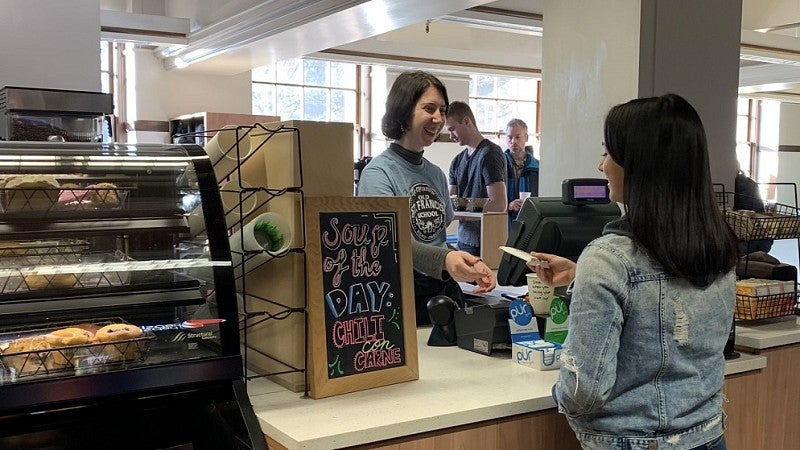 Counter transaction at Cafe Verso in Knight Library