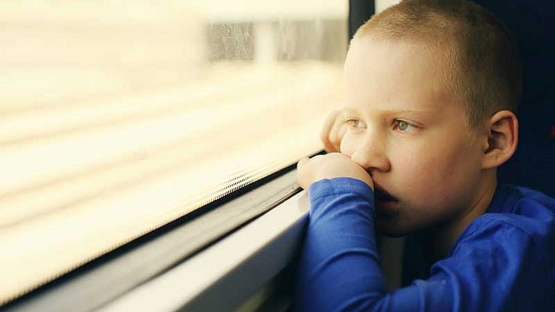 Child looking out window