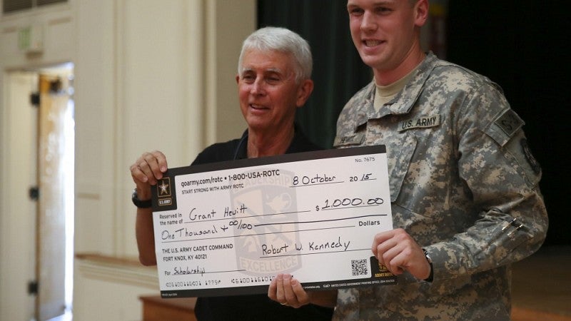 Awarding a scholarship check to cadet Grant Hewitt, a UO economics senior